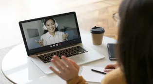 Woman wearing a headset during an online meeting