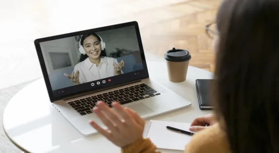 Woman wearing a headset during an online meeting