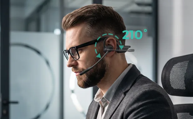 Professional wearing an open ear headphone with mic and adjustable boom for clear business calls