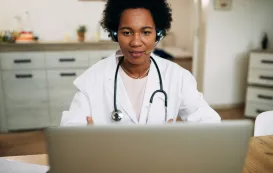 this woman is testing best headphones for telehealth