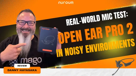 Danny Hayasaka holding the Nuroum OpenEar Pro 2 headset, demonstrating a real-world microphone test in noisy environments.