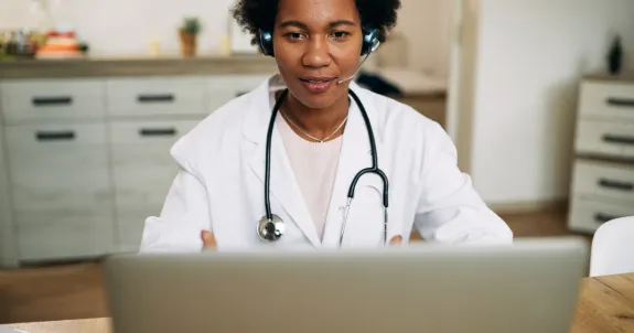 she is using her best headphones for telehealth