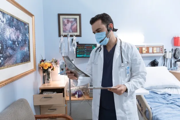 male doctor mask headset xray clipboard hospital
