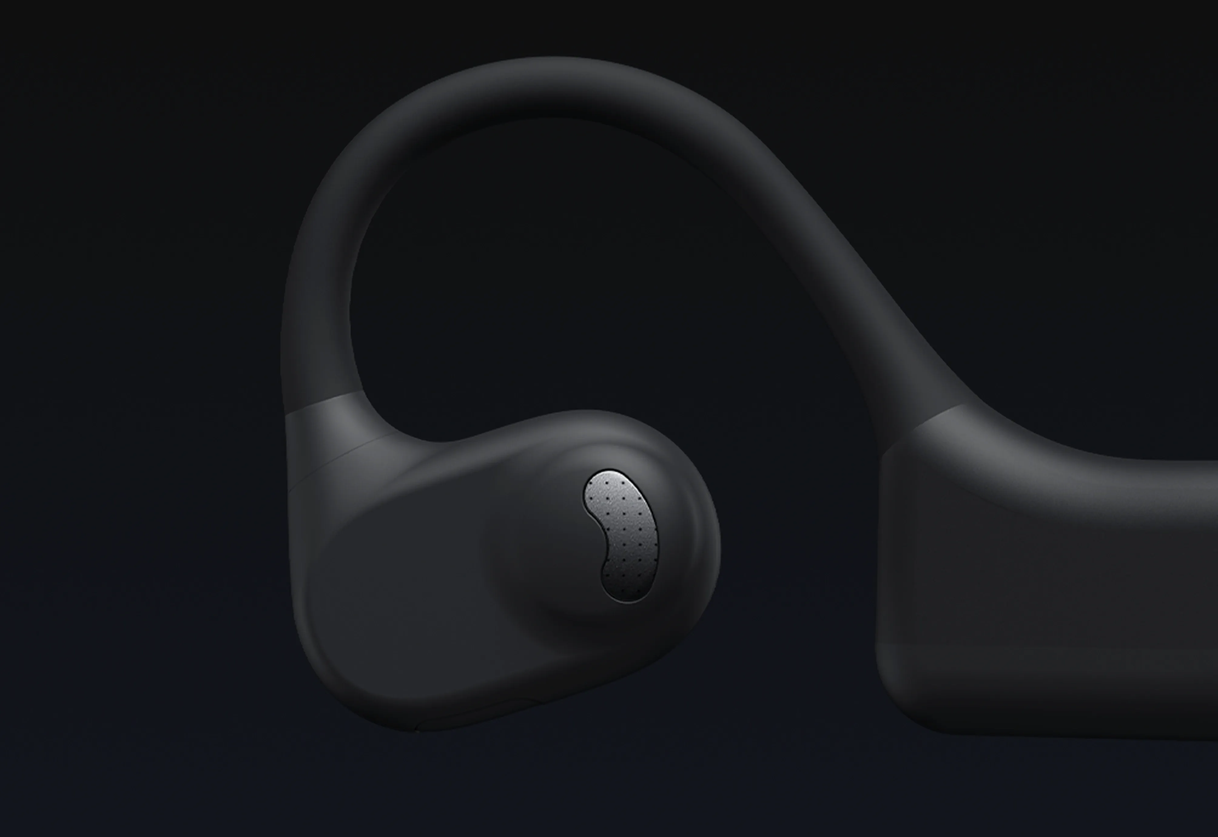 Close-up detail of the silicone earhook and speaker sound port on the Nuroum open-ear headset.