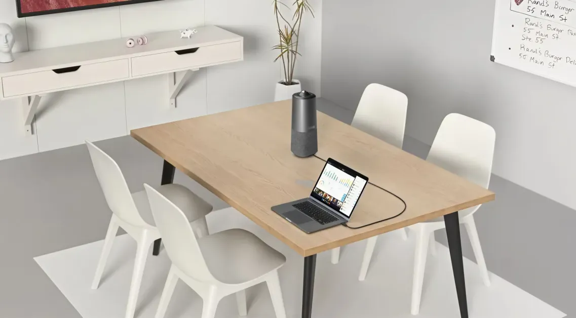 Nuroum 360 Pro C50 on a round meeting table with four chairs