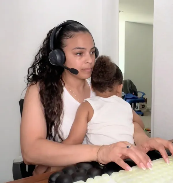 wfh mom wearing work from home headset with noise cancelling microphone